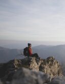 Woman on a mountain overlooking the valley
