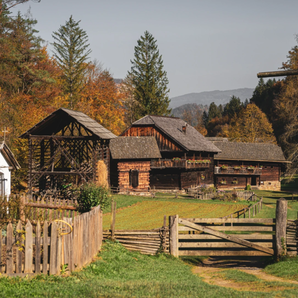 Autumn scene with traditional wooden houses and small chapel at the Austrian Open-Air Museum Stübing