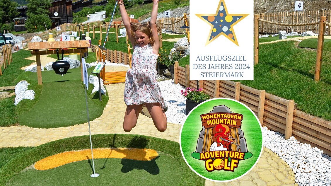 Ein fröhliches Mädchen springt auf einem Minigolfplatz. Im Hintergrund sind der Golfplatz und das Ausflugziel des Jahres 2024 in der Steiermark zu sehen. | © Mountainadventure Golf