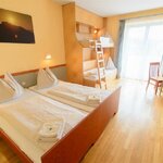 Photo of 4-bed room with balcony | © JUFA Hotel Vulkanland Gnas